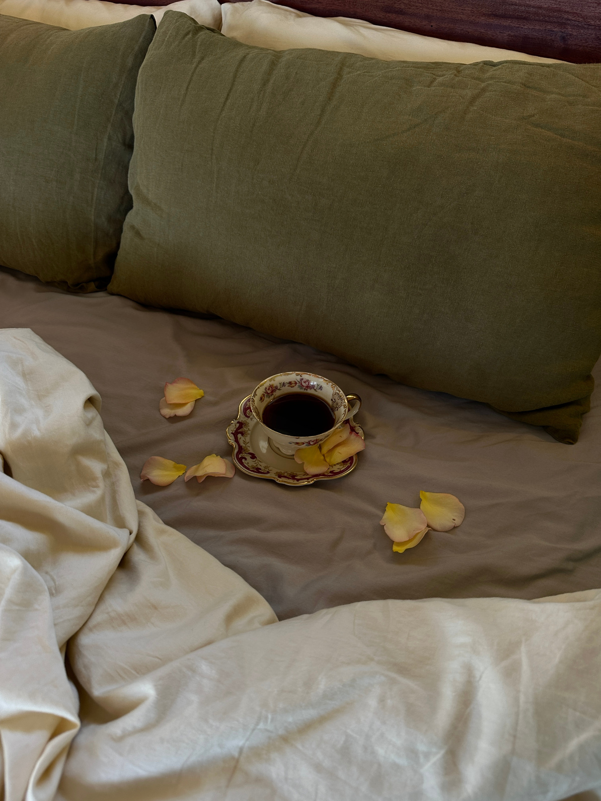 Linen bedding detail with dried petals