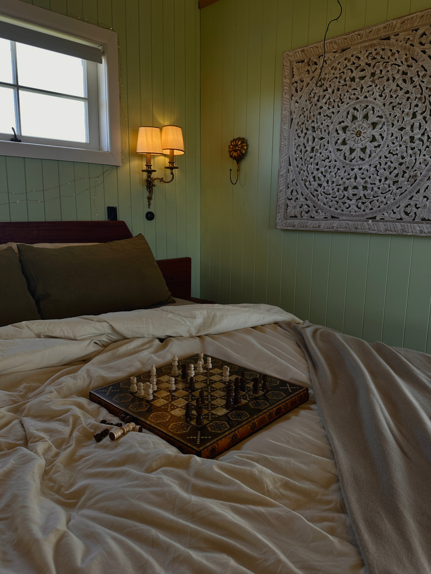 Chess board set on a hotel bed