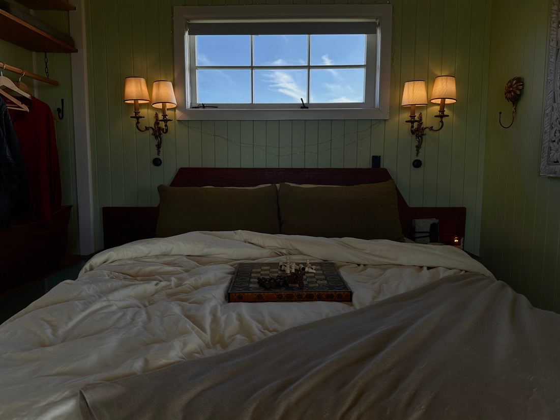 Sunlit bedroom with warm lamps